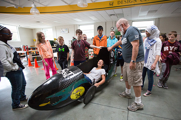 Students explore the Formula SAE car at the Formula SAE summer camp